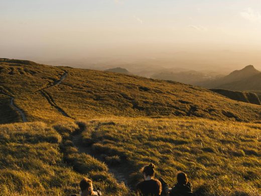 A scenic view of hikers enjoying a sunset in El Valle de Antón, Panama.